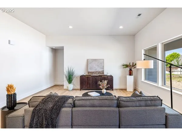 a living room with furniture and a window