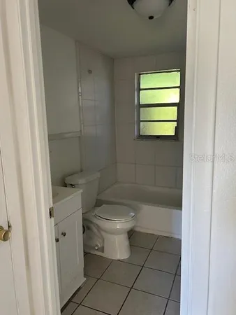 a bathroom with a toilet a sink and shower
