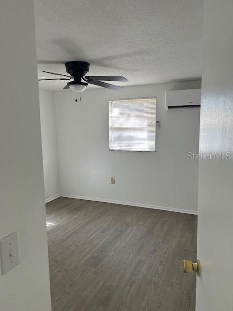 8129 Cass Road Zephyrhills, FL 33540 - Photo 3 of 6 an empty room with a ceiling fan and a window