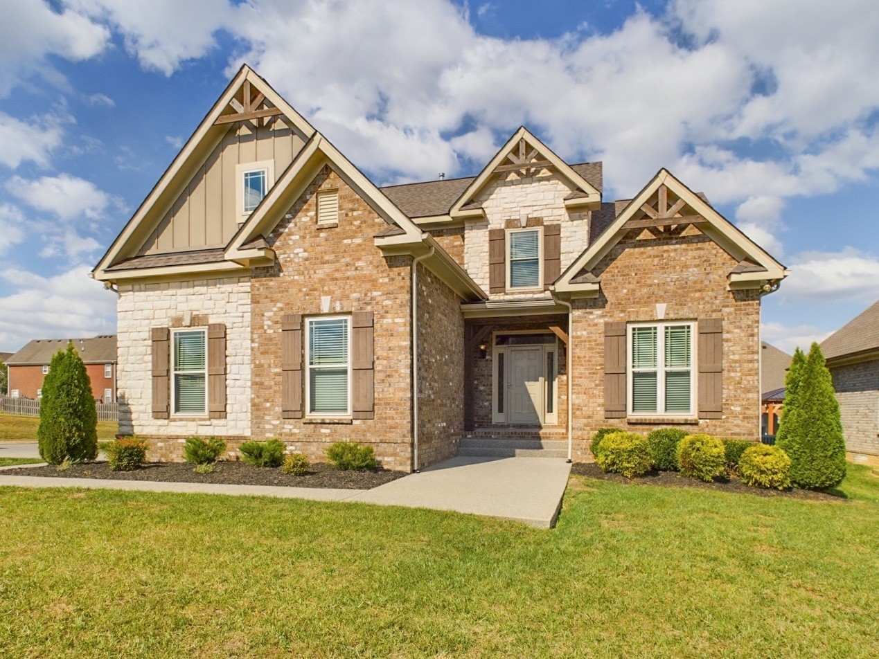 front view of a house with a yard