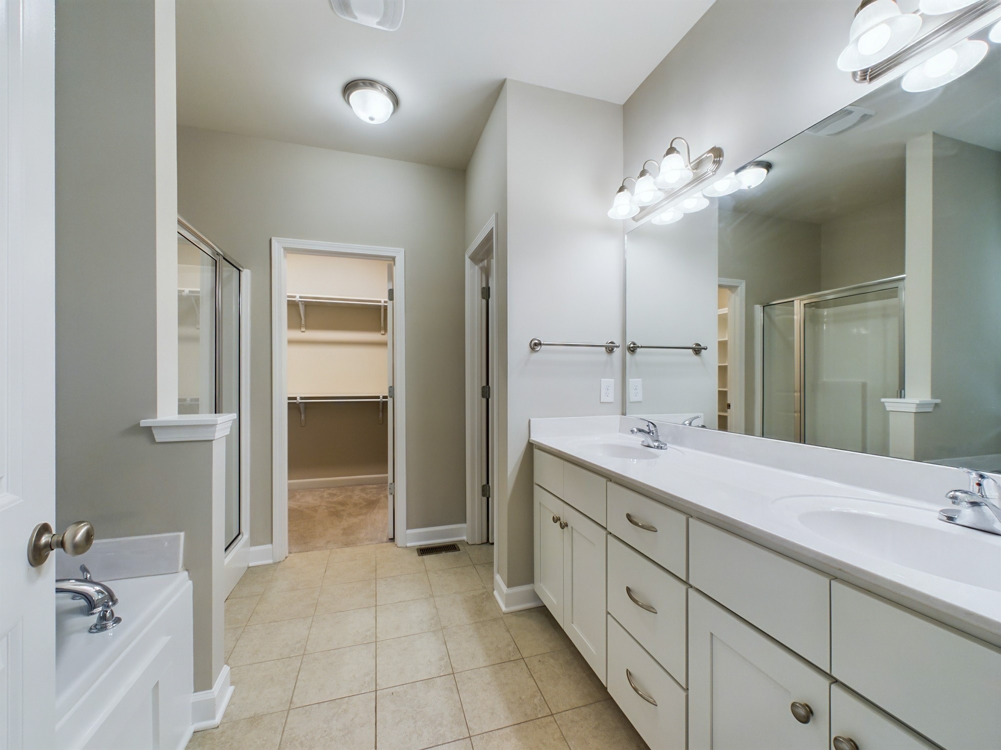 6001 Spade Drive Spring Hill, TN 37174 - Photo 16 of 31 a spacious bathroom with a double vanity sink and a mirror