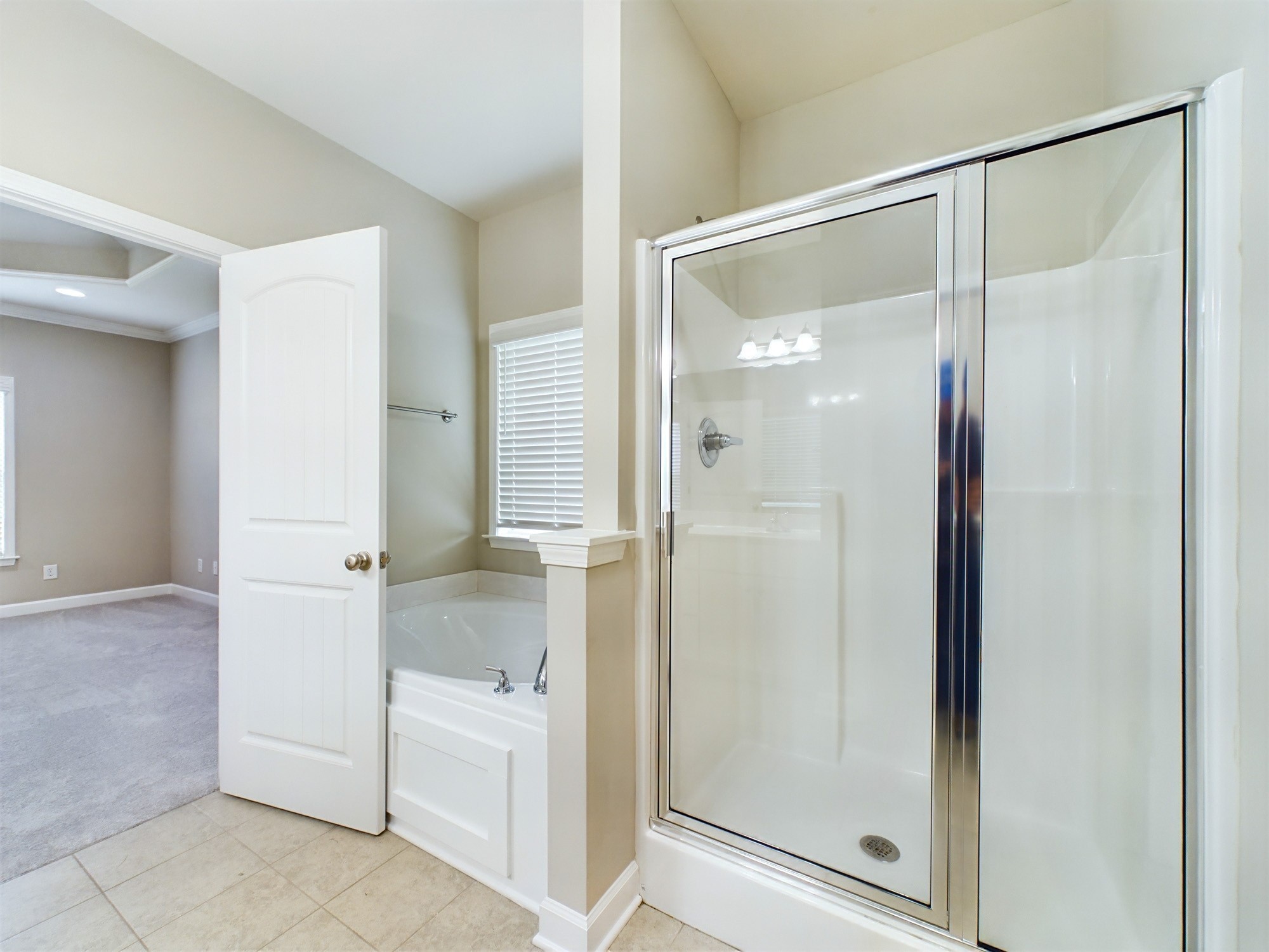 6001 Spade Drive Spring Hill, TN 37174 - Photo 18 of 31 a bathroom with a glass shower door and a sink