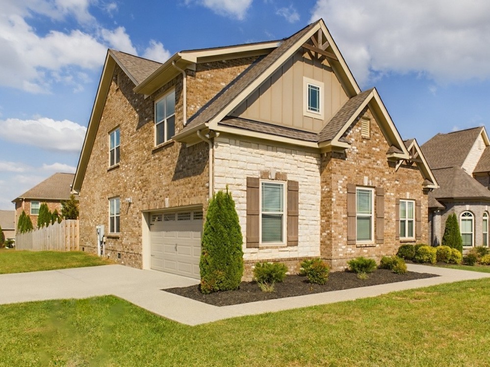 6001 Spade Drive Spring Hill, TN 37174 - Photo 2 of 31 a front view of a house with a yard