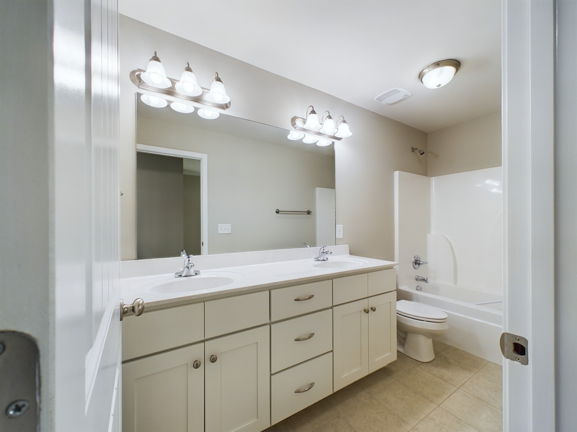 6001 Spade Drive Spring Hill, TN 37174 - Photo 27 of 31 a spacious bathroom with a double vanity sink mirror and toilet