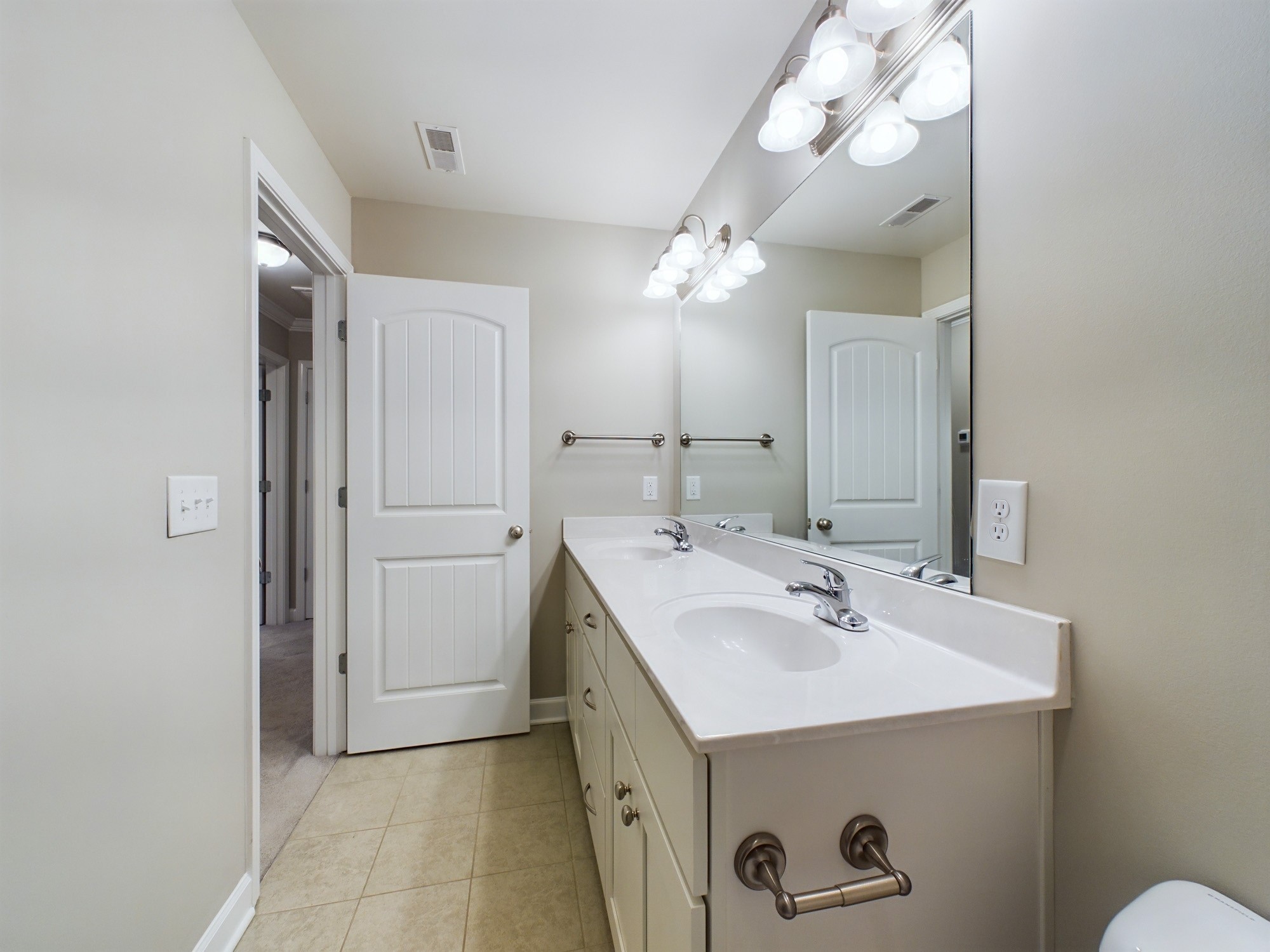 6001 Spade Drive Spring Hill, TN 37174 - Photo 28 of 31 a view of bathroom with a sink a mirror and a light fixture