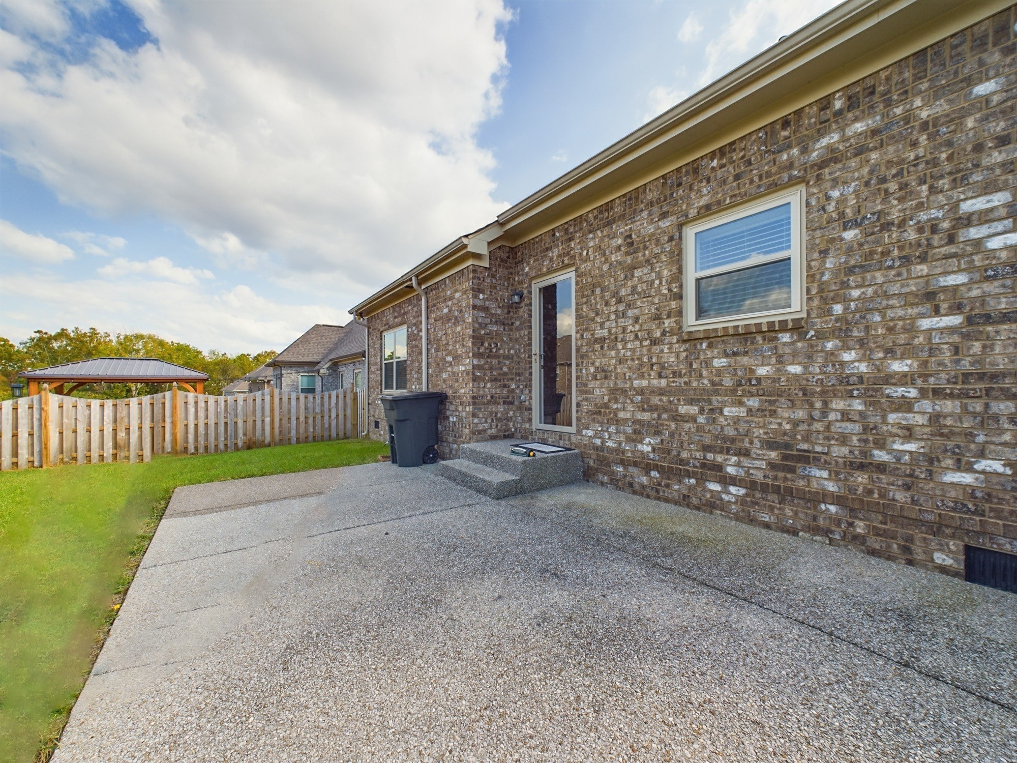 6001 Spade Drive Spring Hill, TN 37174 - Photo 30 of 31 a backyard of a house with wooden fence