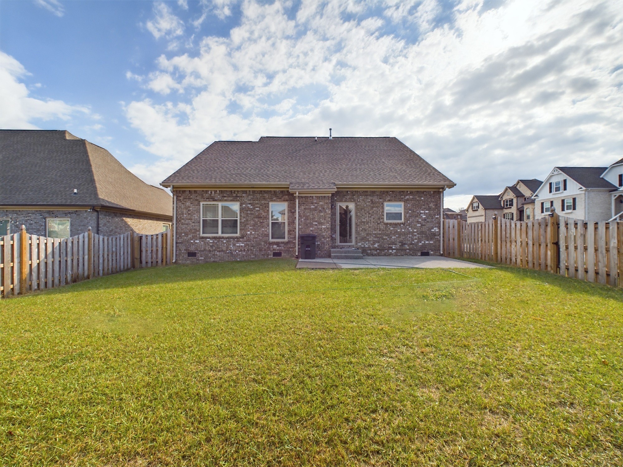 6001 Spade Drive Spring Hill, TN 37174 - Photo 31 of 31 a brick house with a large pool in front of it