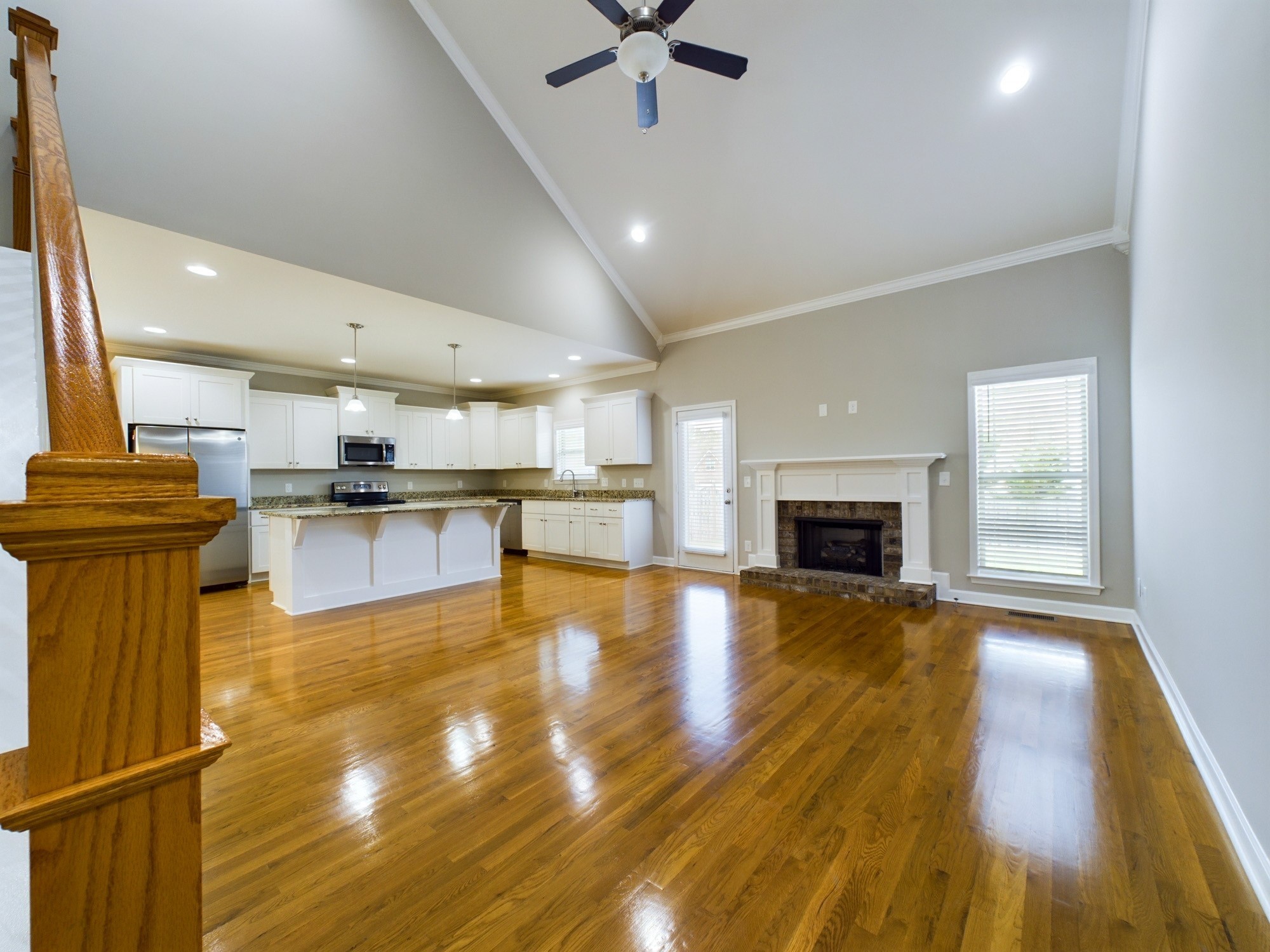 6001 Spade Drive Spring Hill, TN 37174 - Photo 7 of 31 a view of kitchen with wooden floor and a fireplace