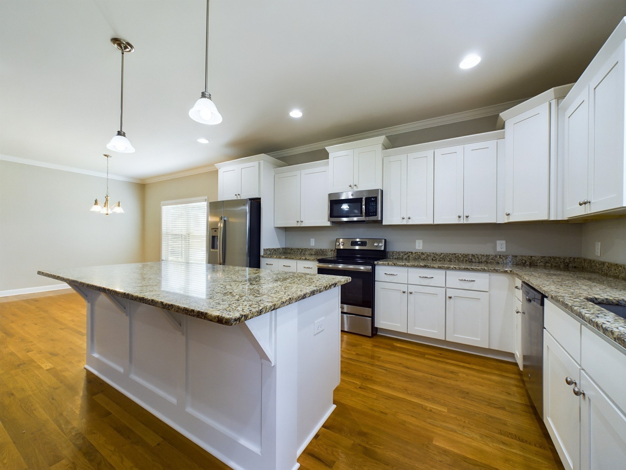 6001 Spade Drive Spring Hill, TN 37174 - Photo 10 of 31 a kitchen with stainless steel appliances granite countertop a sink a stove and cabinets