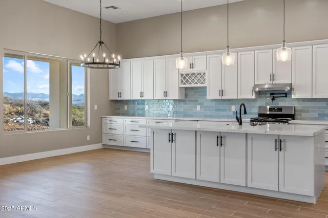 a white bath tub sitting in a bathroom next to a window