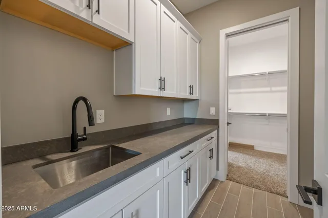 an empty room with a empty space and windows