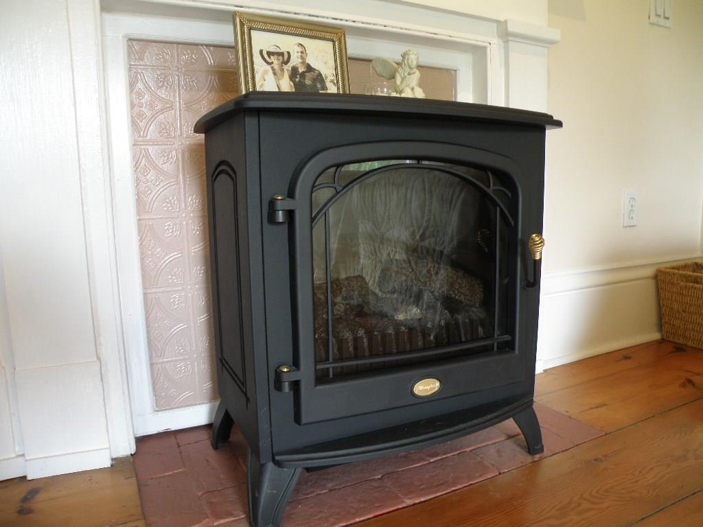 197 Tannery Loop Ellsworth, ME 04605 - Photo 12 of 34 Propane heater has the look of wood...