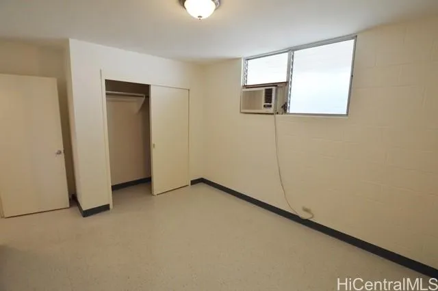 an empty room with a mirror