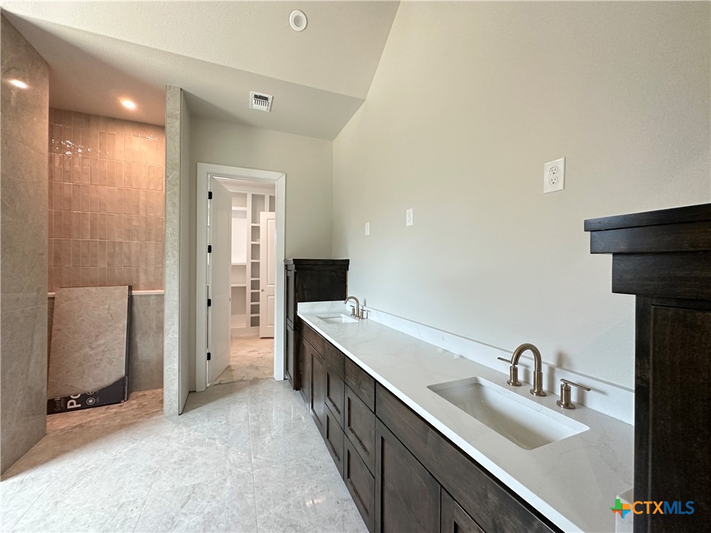 418 Dos Rios Drive Belton, TX 76513 - Photo 30 of 41 a bathroom with a double vanity sink and mirror