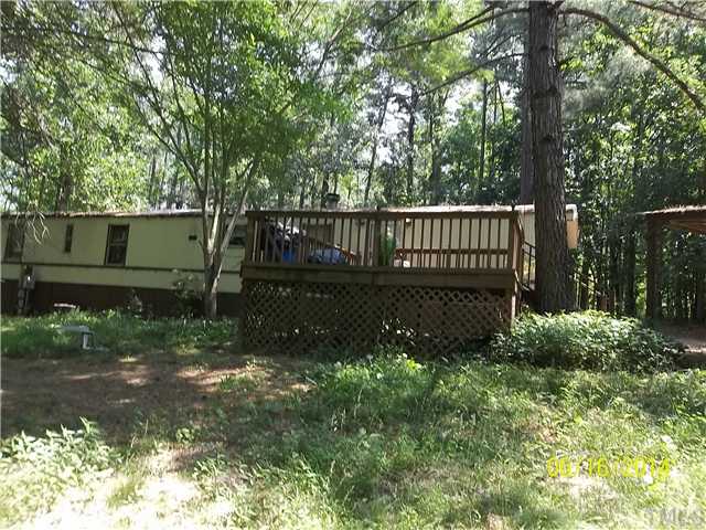 2333 Thomas Road Henderson, NC 27537 - Photo 1 of 3 a view of a backyard with wooden fence