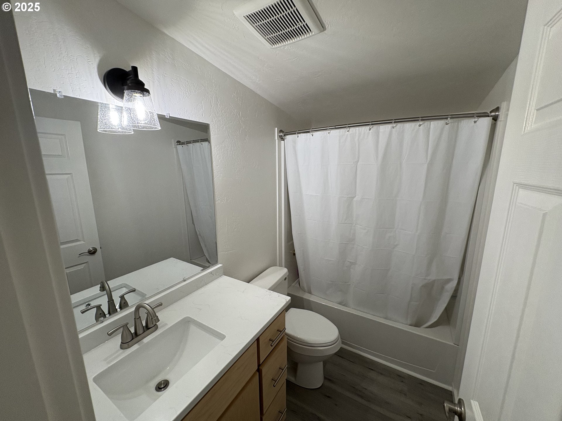 605 South 2nd Street Springfield, OR 97477 - Photo 13 of 20 a bathroom with a sink a toilet and shower