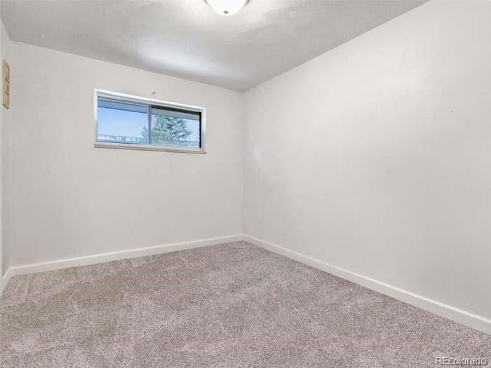 4615 Field Street Wheat Ridge, CO 80033 - Photo 10 of 13 an empty room with a window
