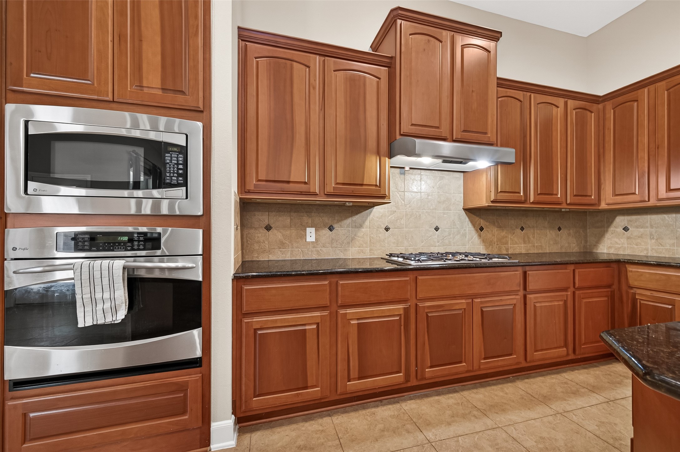 2310 Spring Lake Park Lane Spring, TX 77386 - Photo 20 of 47 a kitchen with granite countertop cabinets stainless steel appliances and a counter space