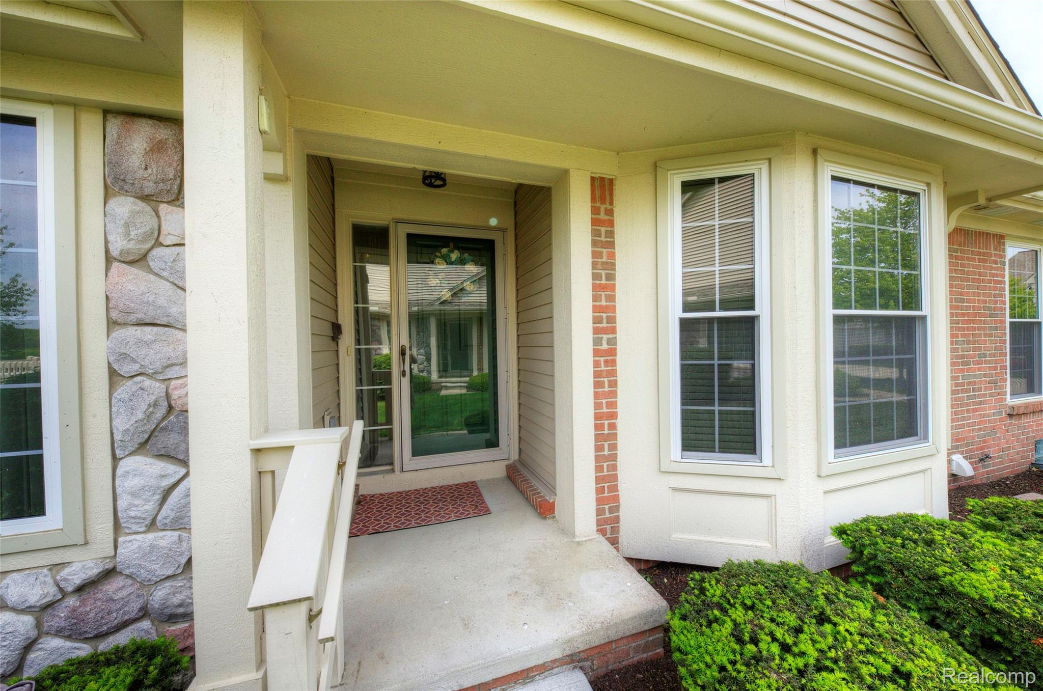 2577 Cleveland Way Canton, MI 48188 - Photo 3 of 34 Entrance to property with stone siding and a porch