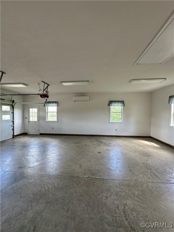 860 Allens Lake Road Dillwyn, VA 23936 - Photo 26 of 47 Garage with a wall unit AC, a garage door opener,