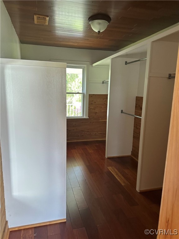860 Allens Lake Road Dillwyn, VA 23936 - Photo 36 of 47 Hall with visible vents, wood walls, dark wood-sty