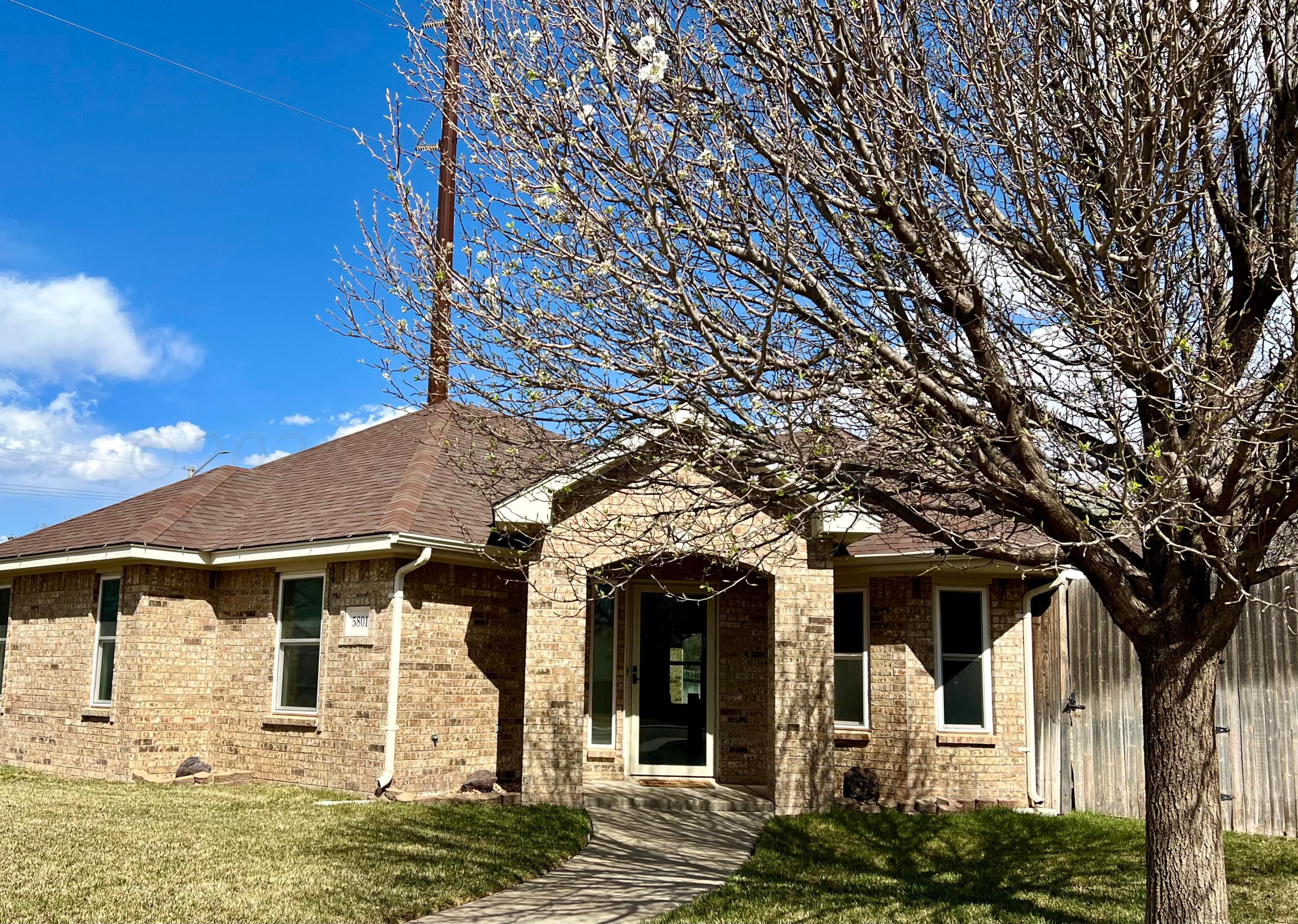 a front view of a house with large windows