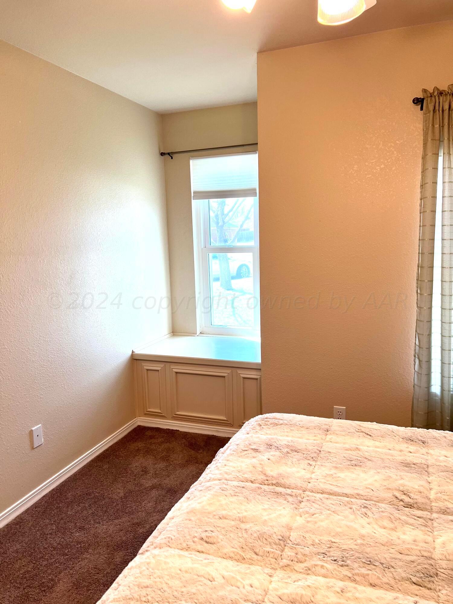 5801 South Bowie Street Amarillo, TX 79118 - Photo 16 of 23 a bedroom with a bed and a window