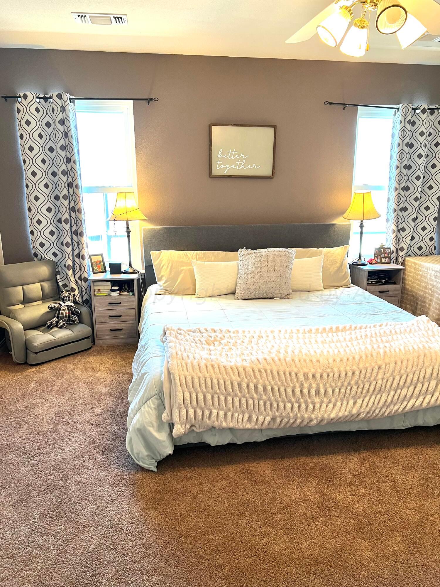 5801 South Bowie Street Amarillo, TX 79118 - Photo 17 of 23 a bedroom with a bed and couch