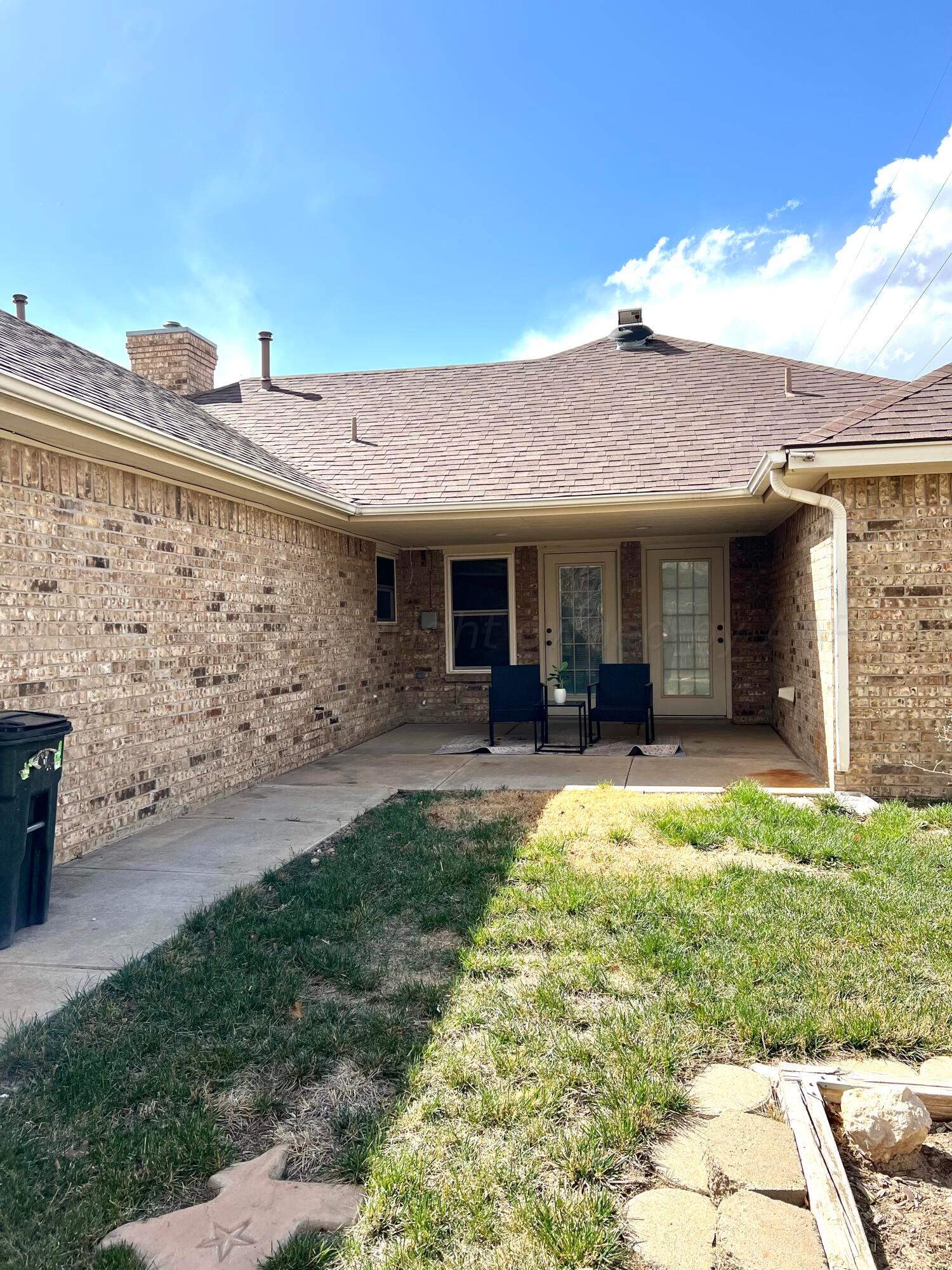 5801 South Bowie Street Amarillo, TX 79118 - Photo 22 of 23 a view of a house with backyard porch and garden
