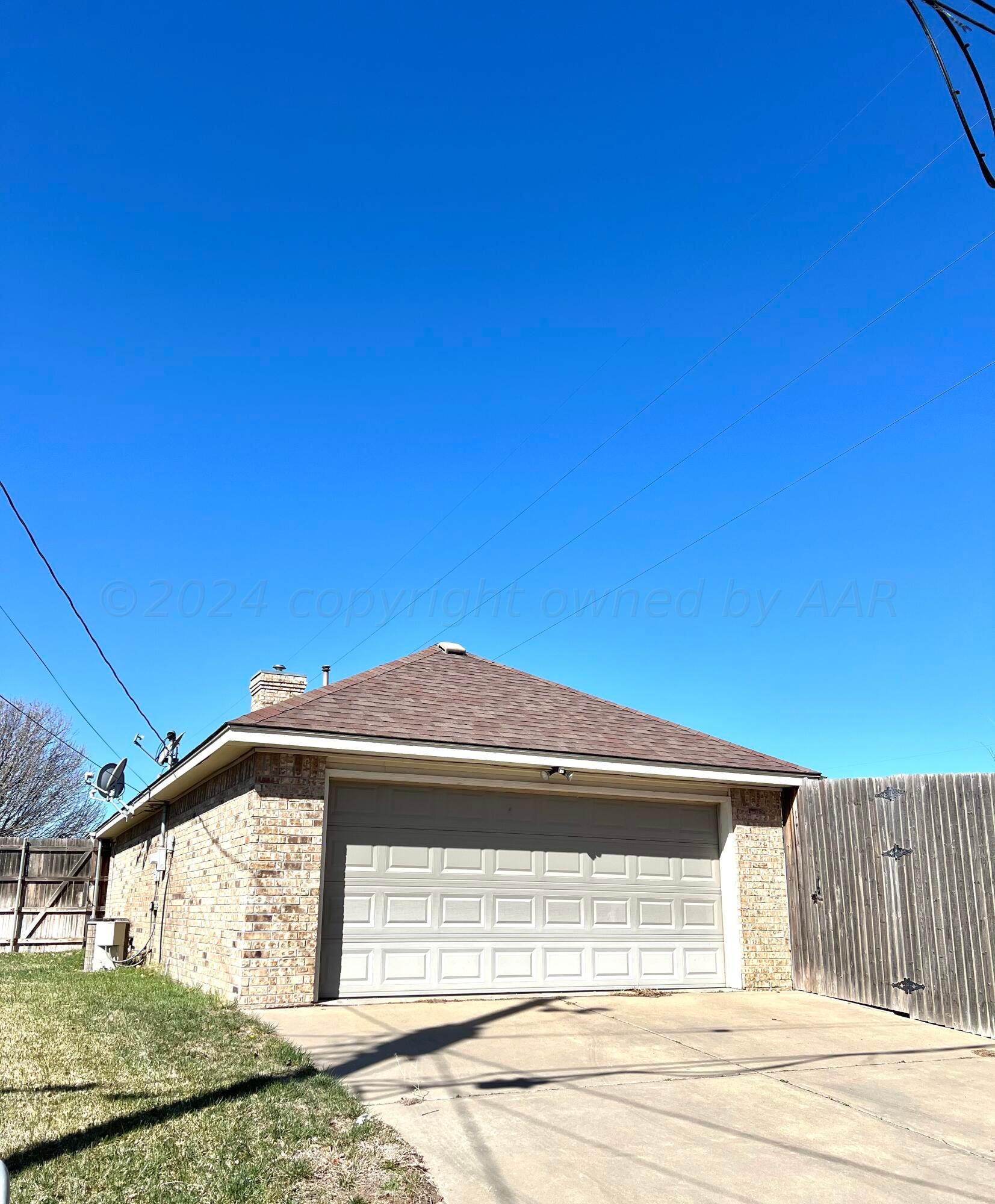 5801 South Bowie Street Amarillo, TX 79118 - Photo 23 of 23 a view of a house with a wooden fence
