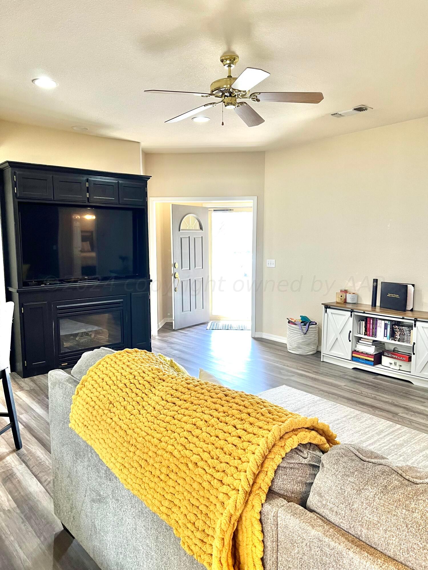 5801 South Bowie Street Amarillo, TX 79118 - Photo 4 of 23 a bedroom with a bed and a flat screen tv
