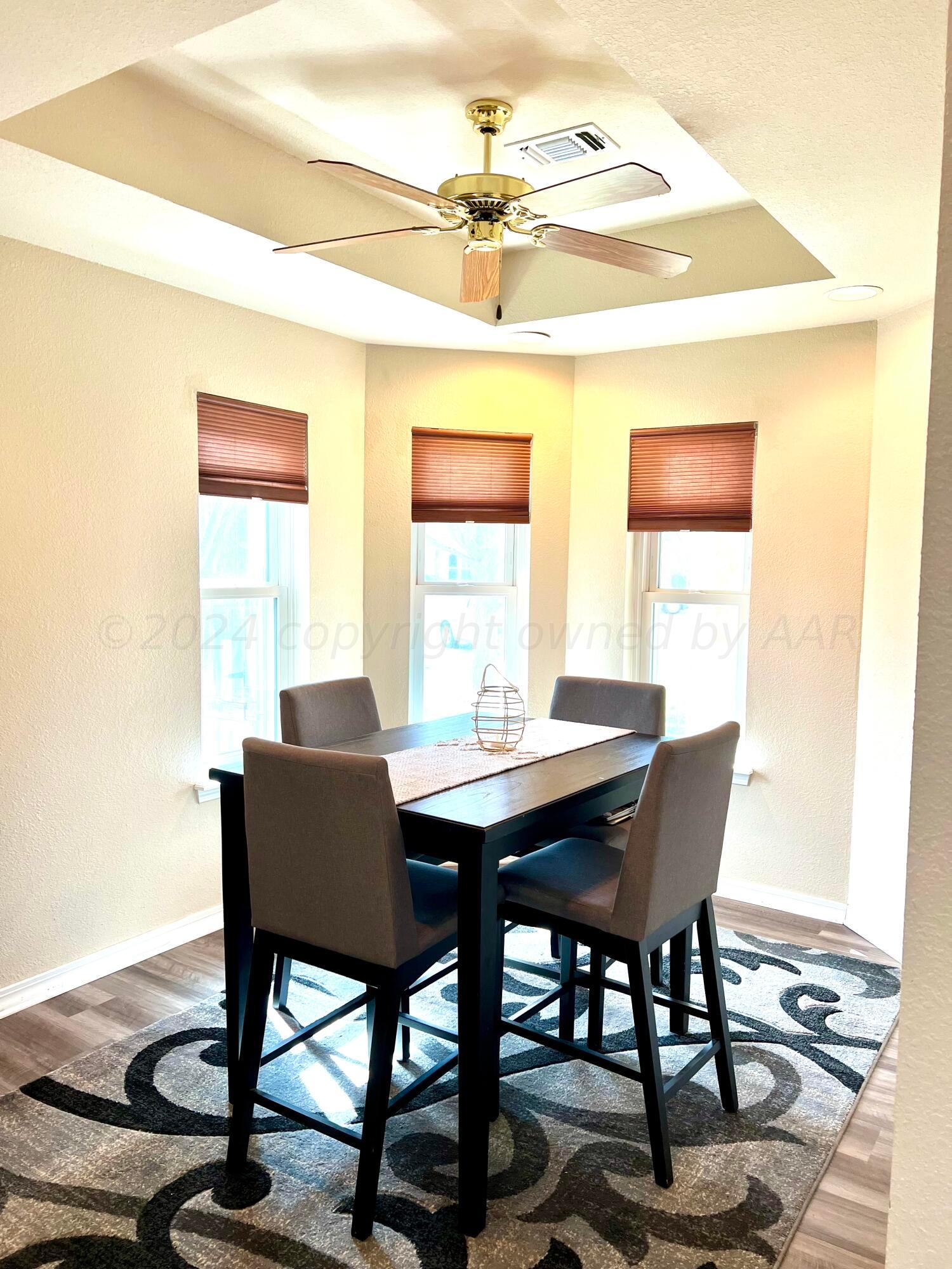 5801 South Bowie Street Amarillo, TX 79118 - Photo 9 of 23 a view of a dining room with furniture and a window