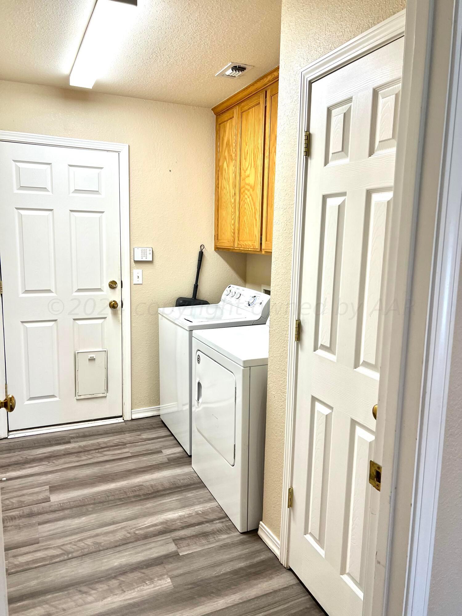 5801 South Bowie Street Amarillo, TX 79118 - Photo 10 of 23 a view of a hallway with washer and dryer