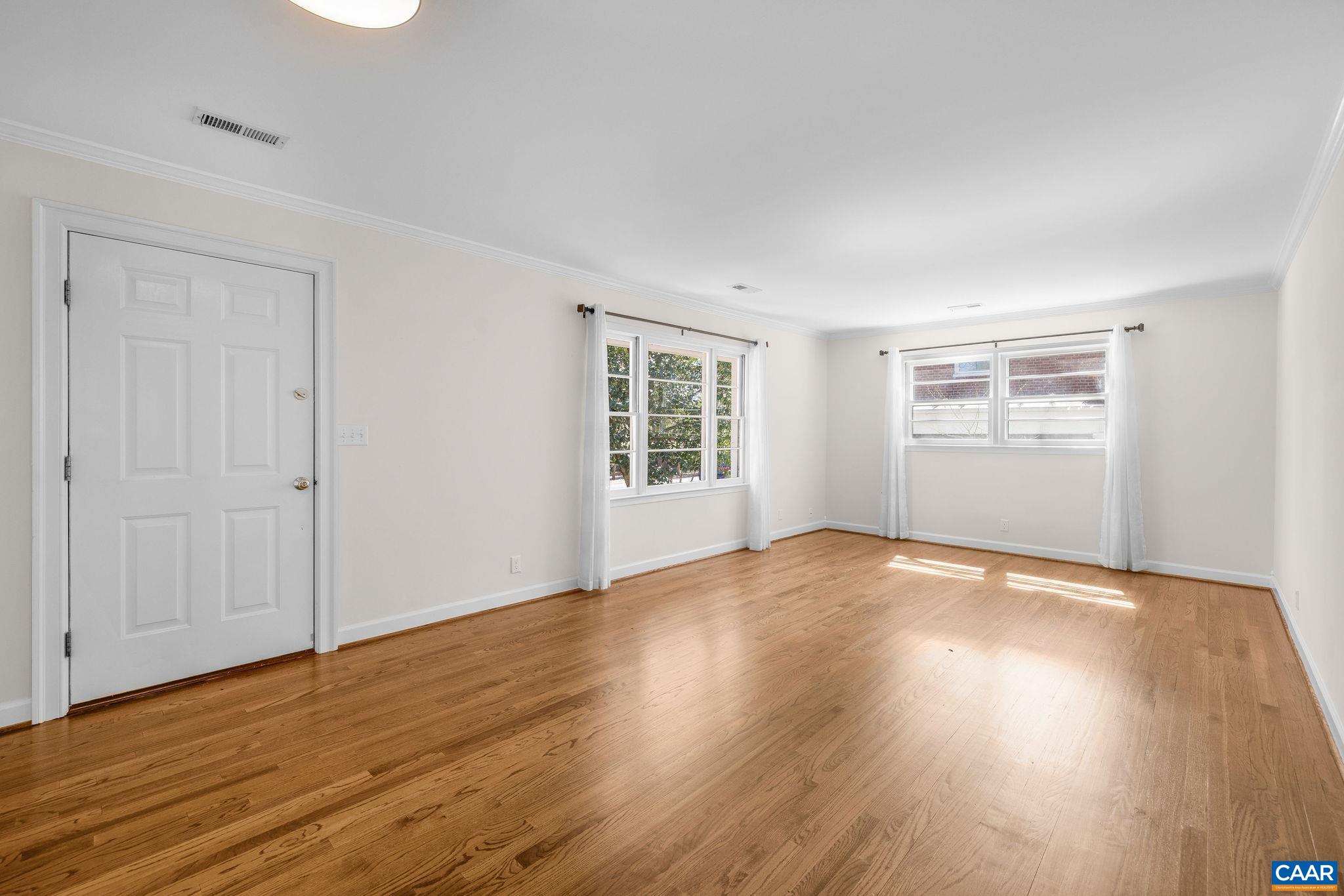26 University Circle Charlottesville, VA 22903 - Photo 20 of 38 a view of empty room with wooden floor and fan