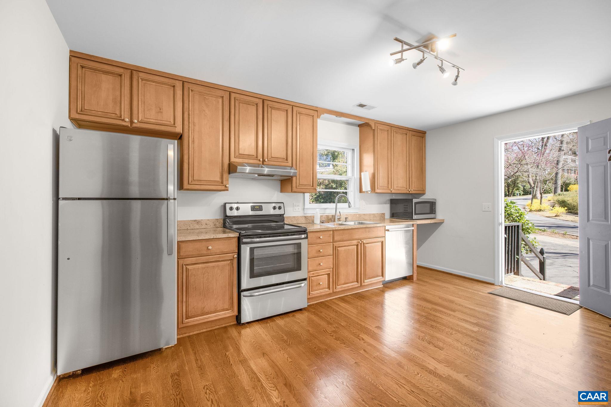26 University Circle Charlottesville, VA 22903 - Photo 24 of 38 a kitchen with a refrigerator and a stove top oven