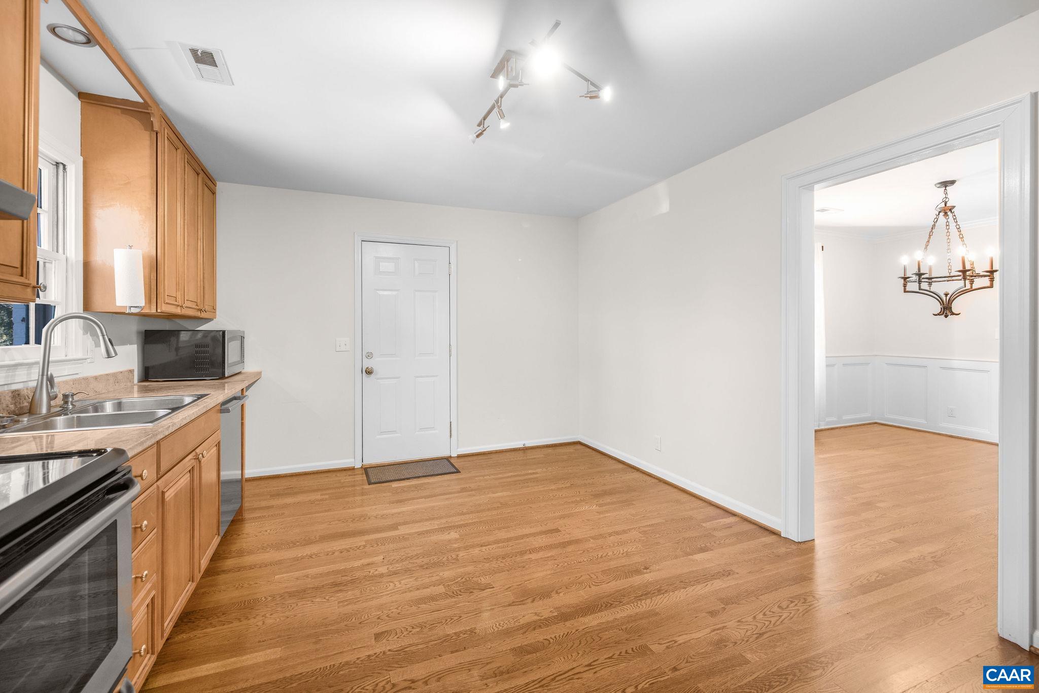 26 University Circle Charlottesville, VA 22903 - Photo 25 of 38 a view of a kitchen with a sink and wooden floor