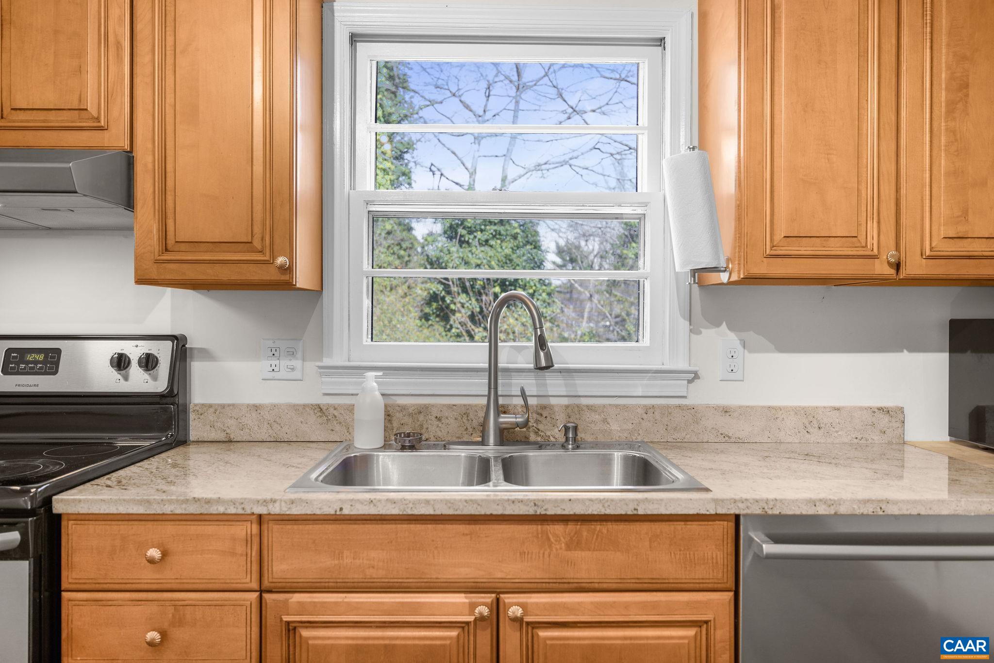 26 University Circle Charlottesville, VA 22903 - Photo 26 of 38 a kitchen with stainless steel appliances granite countertop a sink and a window