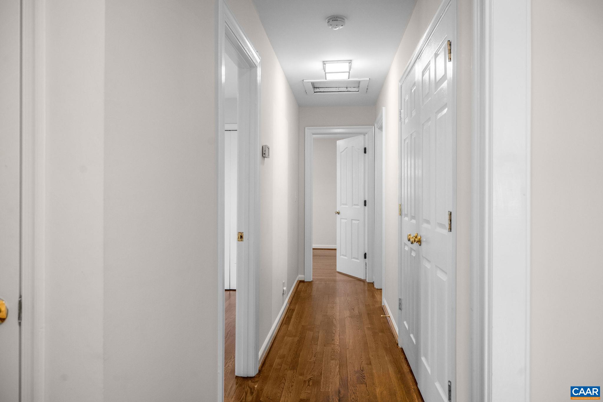 26 University Circle Charlottesville, VA 22903 - Photo 27 of 38 a view of a hallway with wooden floor