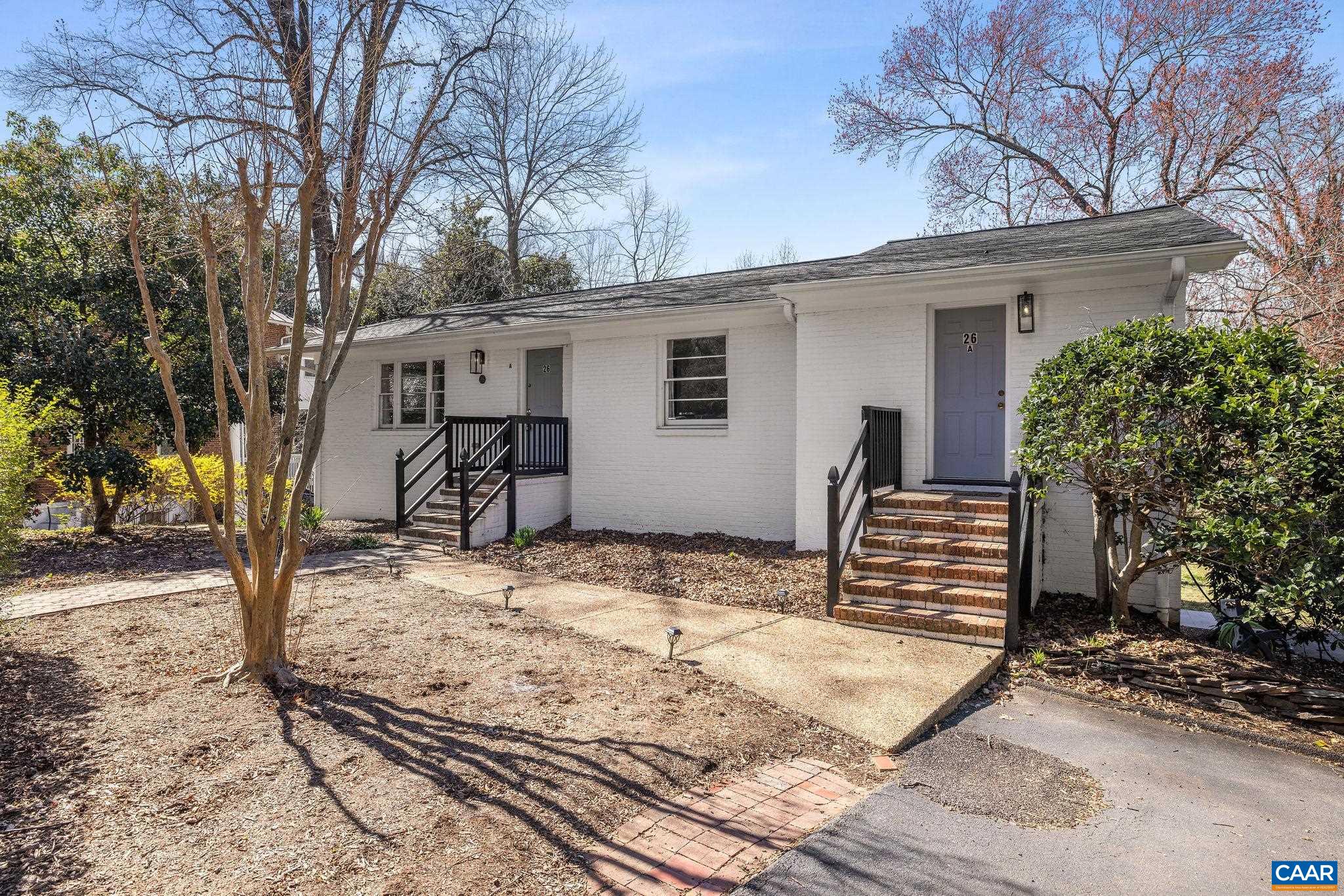26 University Circle Charlottesville, VA 22903 - Photo 3 of 38 a view of a yard with snow on the house