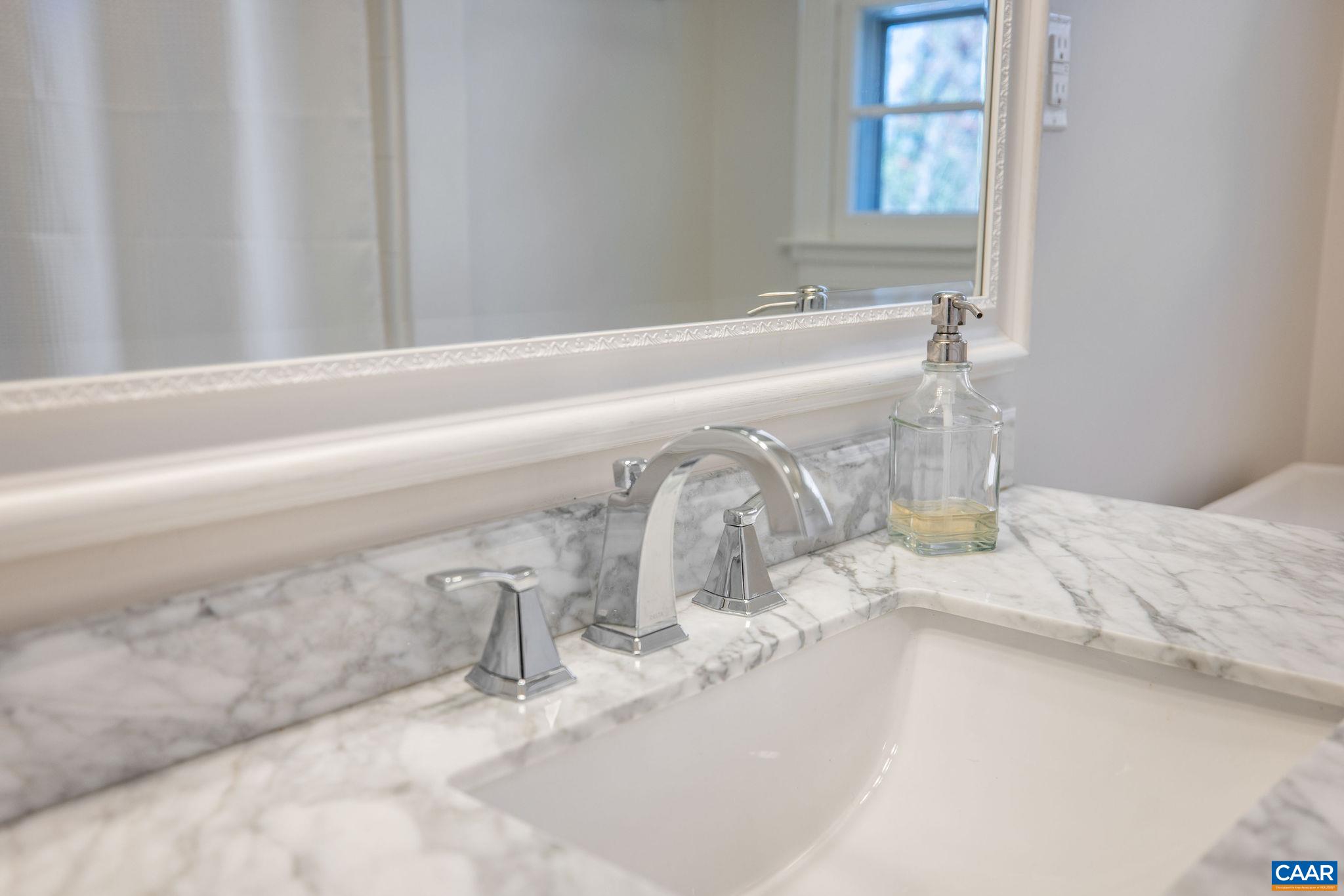 26 University Circle Charlottesville, VA 22903 - Photo 32 of 38 a bathroom with a granite countertop sink and a mirror