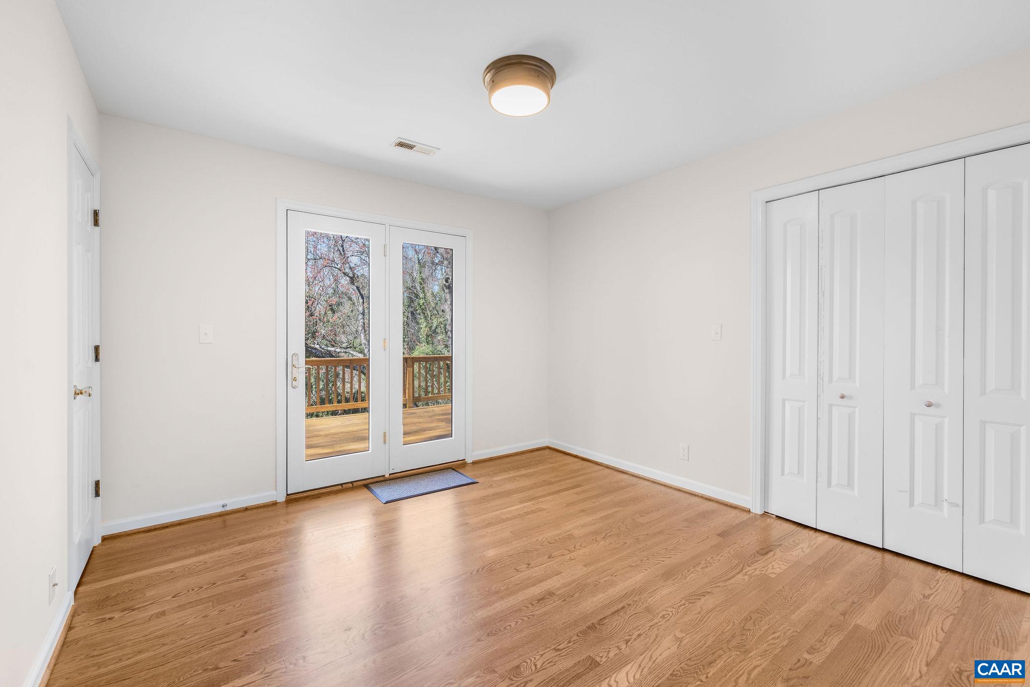 26 University Circle Charlottesville, VA 22903 - Photo 33 of 38 a view of an empty room with wooden floor and a window