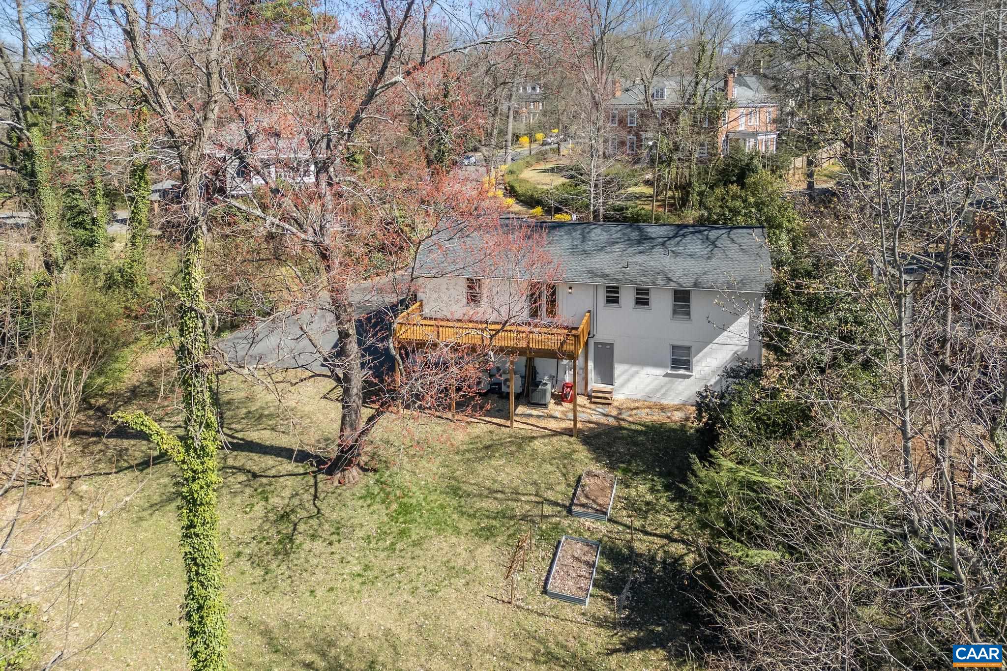 26 University Circle Charlottesville, VA 22903 - Photo 6 of 38 a view of a fireplace with a tree in front of it