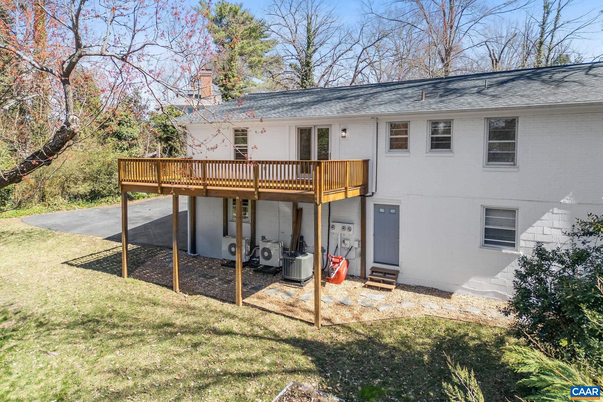 26 University Circle Charlottesville, VA 22903 - Photo 7 of 38 a view of a house with a patio and wooden fence