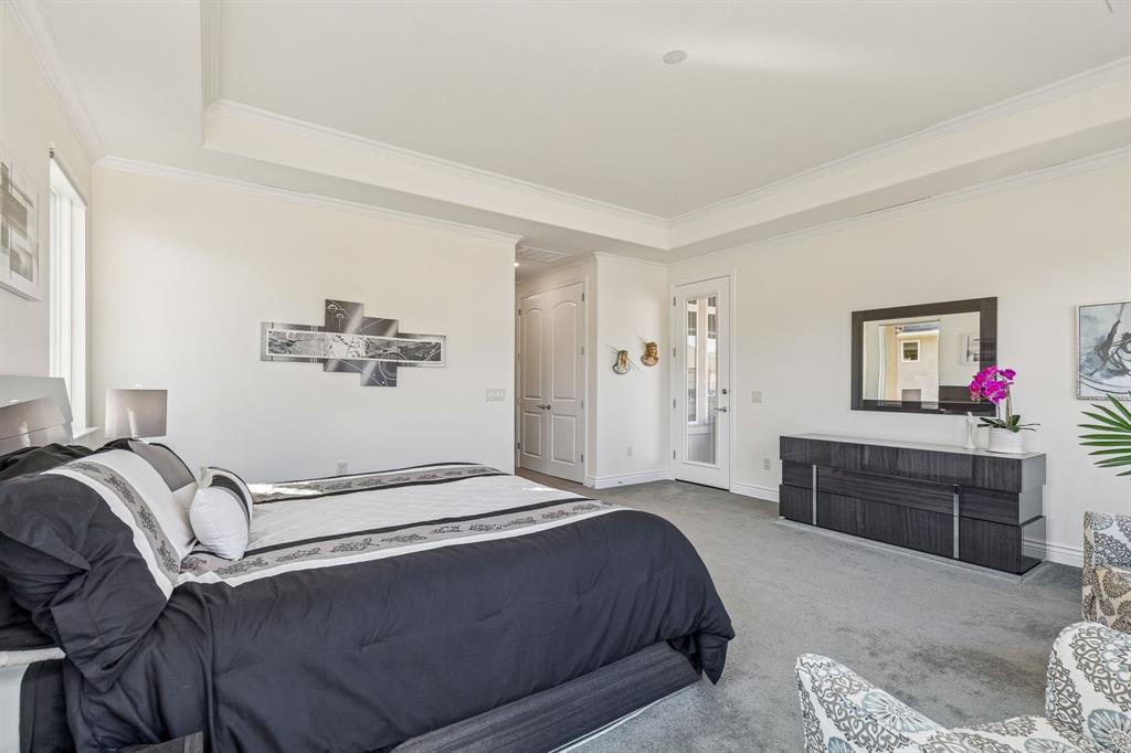 8717 Basanite Avenue Denton, TX 76207 - Photo 13 of 30 a bedroom with a bed and a dresser