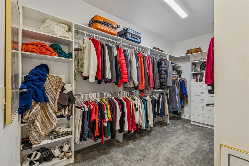 8717 Basanite Avenue Denton, TX 76207 - Photo 20 of 30 a view of walk in closet with clothes