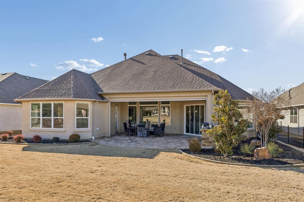 8717 Basanite Avenue Denton, TX 76207 - Photo 30 of 30 a front view of a house with a yard