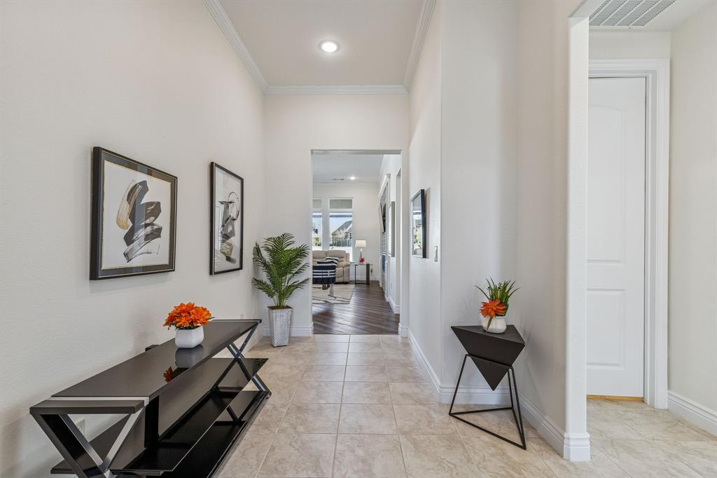 8717 Basanite Avenue Denton, TX 76207 - Photo 3 of 30 a living room with furniture and a potted plant