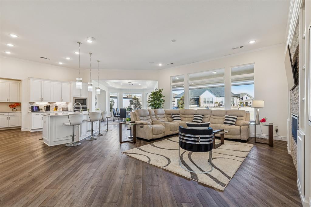 8717 Basanite Avenue Denton, TX 76207 - Photo 4 of 30 a living room with furniture and a wooden floor