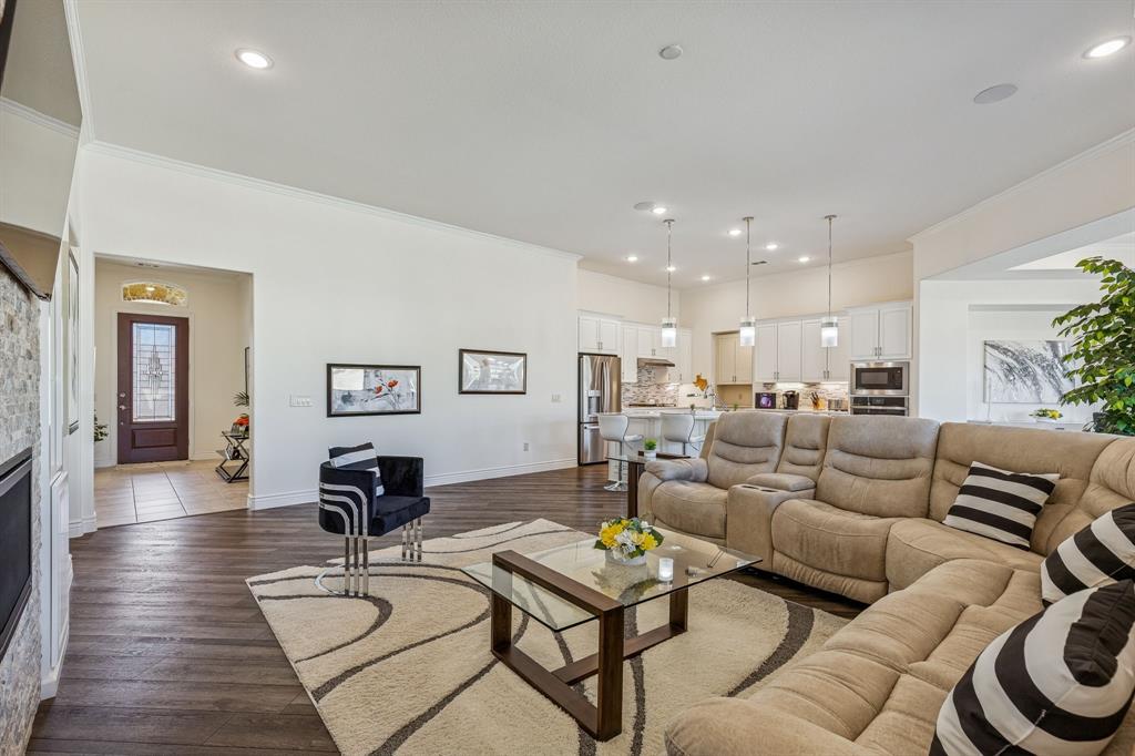 8717 Basanite Avenue Denton, TX 76207 - Photo 6 of 30 a living room with furniture and wooden floor