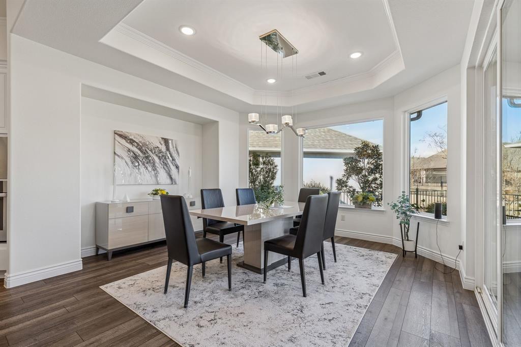 8717 Basanite Avenue Denton, TX 76207 - Photo 10 of 30 a view of a dining room with furniture window and wooden floor